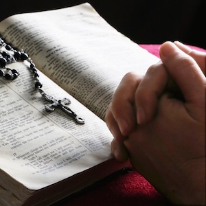 hand-bible-rosary